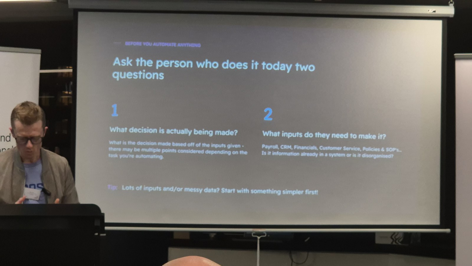 Matt Reid presenting a slide titled Ask the person who does it today two questions