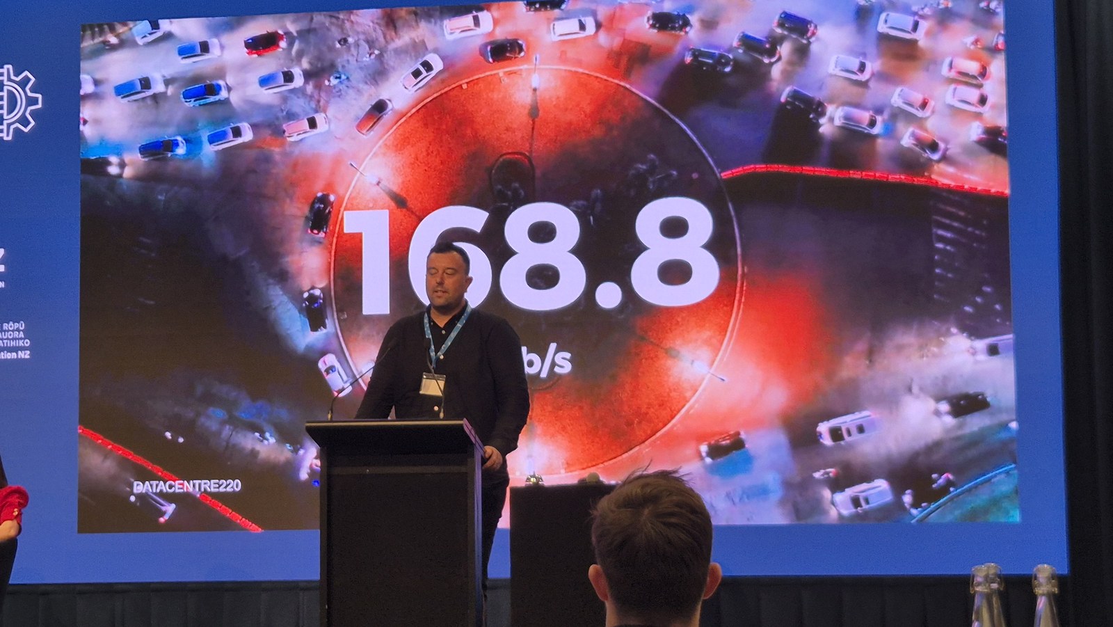 Slide showing 168.8 Gb/s over an image of traffic, illustrating the volume of internet traffic passing through Datacentre220