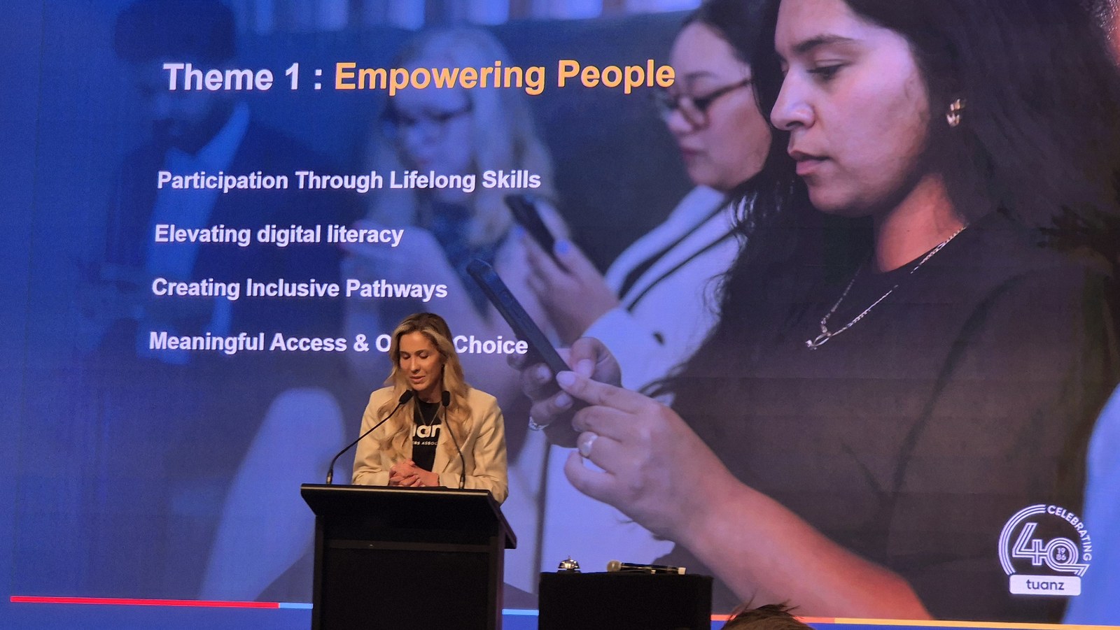 Slide headed Theme 1: Empowering People, listing participation through lifelong skills, elevating digital literacy, creating inclusive pathways, and meaningful access and online choice